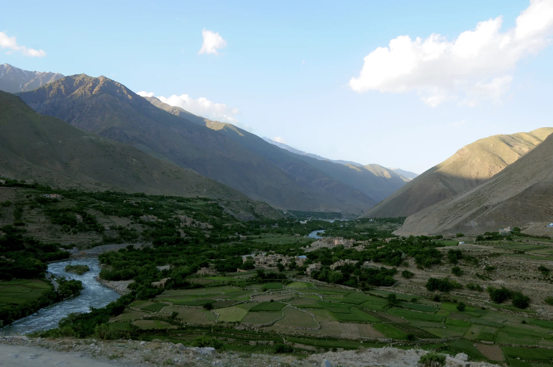 Green Panjshir River Valley and mountain slopes